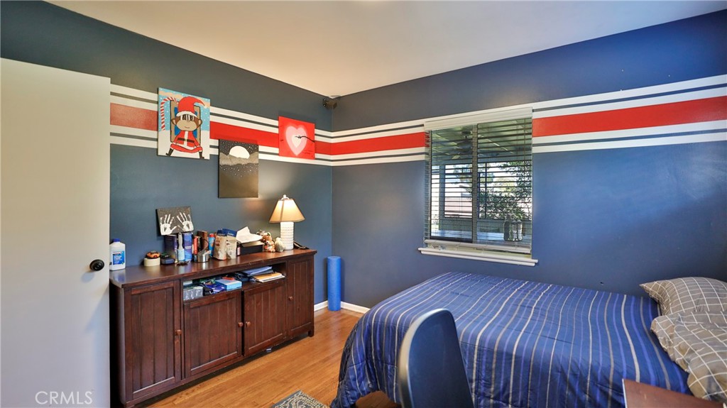 5035 Greer Avenue Covina, CA 91724 - Photo 24 of 37 a room that has a bed and a bookshelf in it