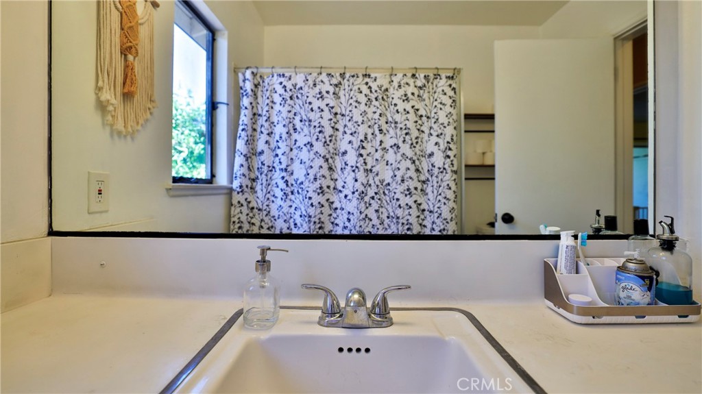 5035 Greer Avenue Covina, CA 91724 - Photo 25 of 37 a bathroom with a bathtub sink and mirror