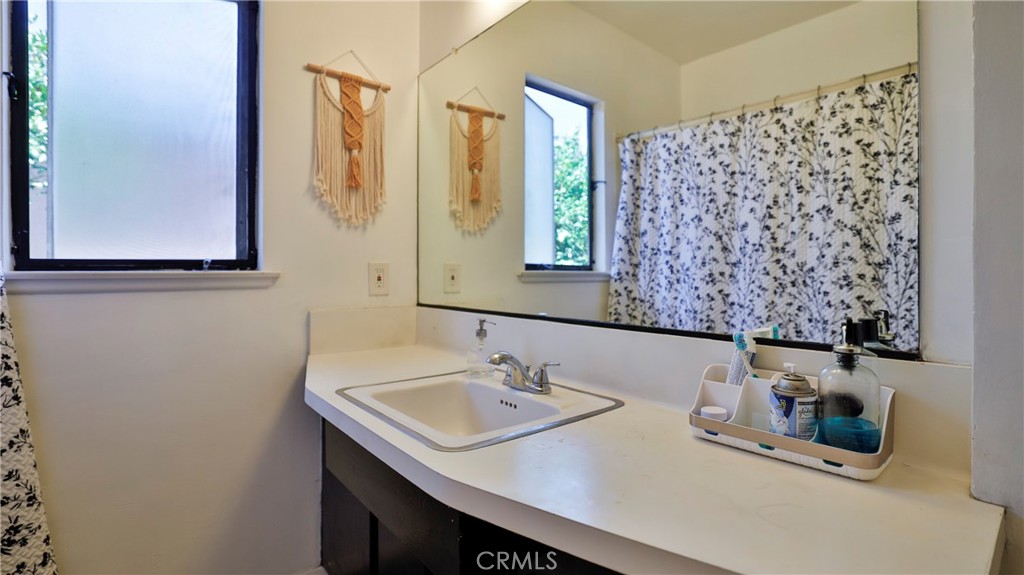 5035 Greer Avenue Covina, CA 91724 - Photo 26 of 37 a bathroom with a sink and a mirror