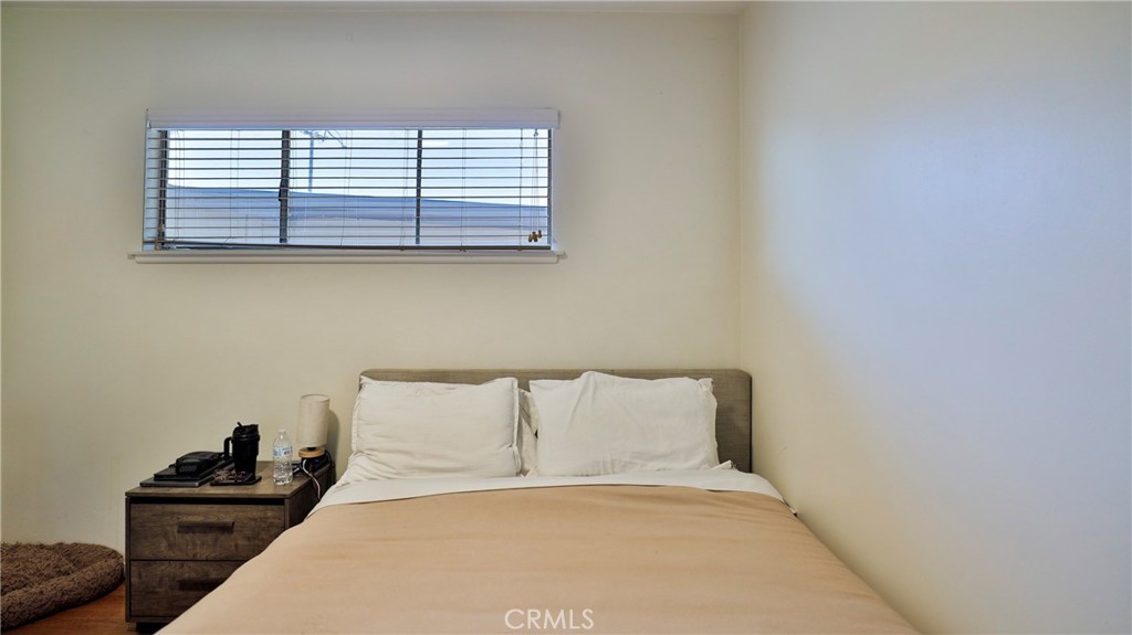 5035 Greer Avenue Covina, CA 91724 - Photo 29 of 37 a bedroom with a bed and a window