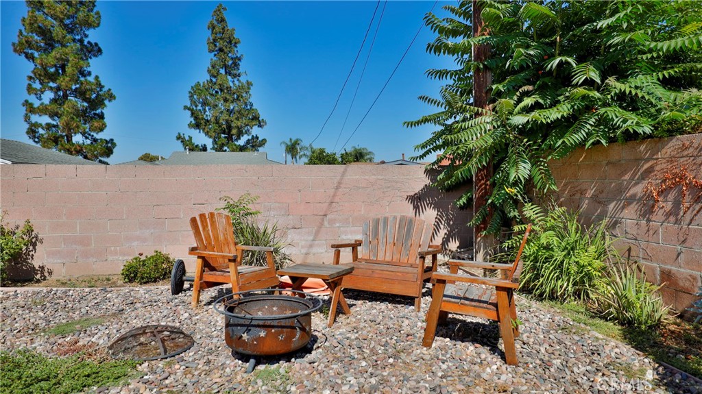5035 Greer Avenue Covina, CA 91724 - Photo 35 of 37 a backyard of a house with table and chairs plants and large trees