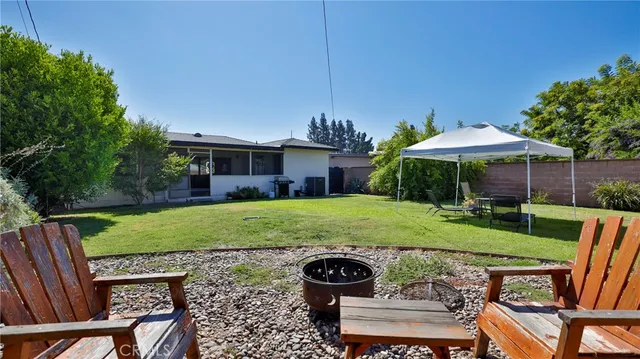 a front view of house with yard and trees