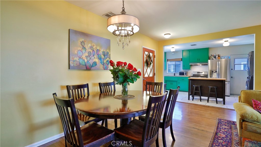 5035 Greer Avenue Covina, CA 91724 - Photo 9 of 37 a view of a dining room with furniture a chandelier and wooden floor