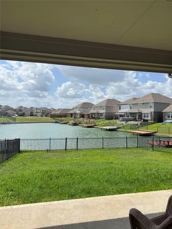 a view of yard with swimming pool and green space
