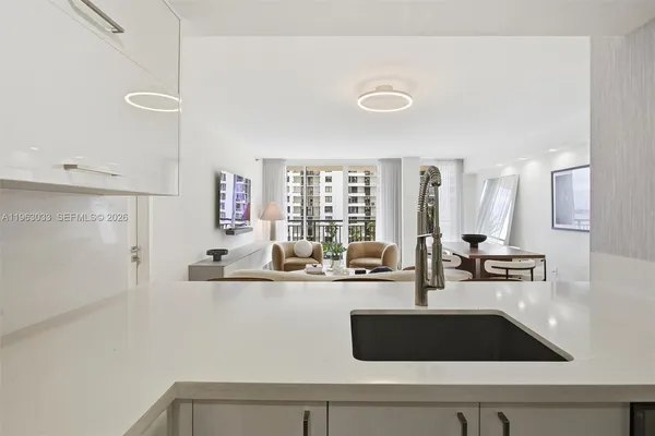 a table with a sink and cabinets
