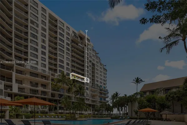 a view of a swimming pool with outdoor seating