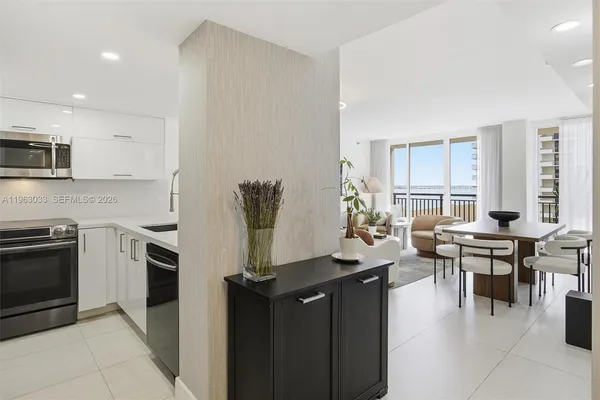 a kitchen with counter top space appliances and cabinets