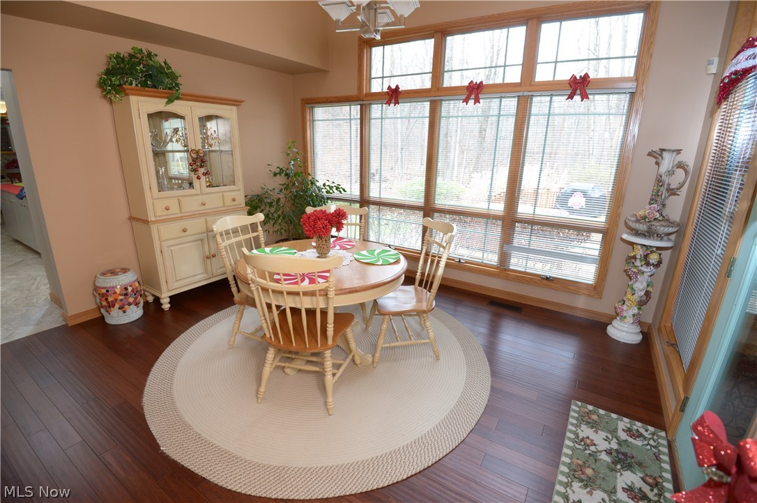 2749 Howland Wilson Road Northeast Warren, OH 44484 - Photo 10 of 25 dining room (door to the right leads to screened deck) - bamboo floors throughout the first floor
