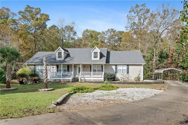 front view of a house with a yard