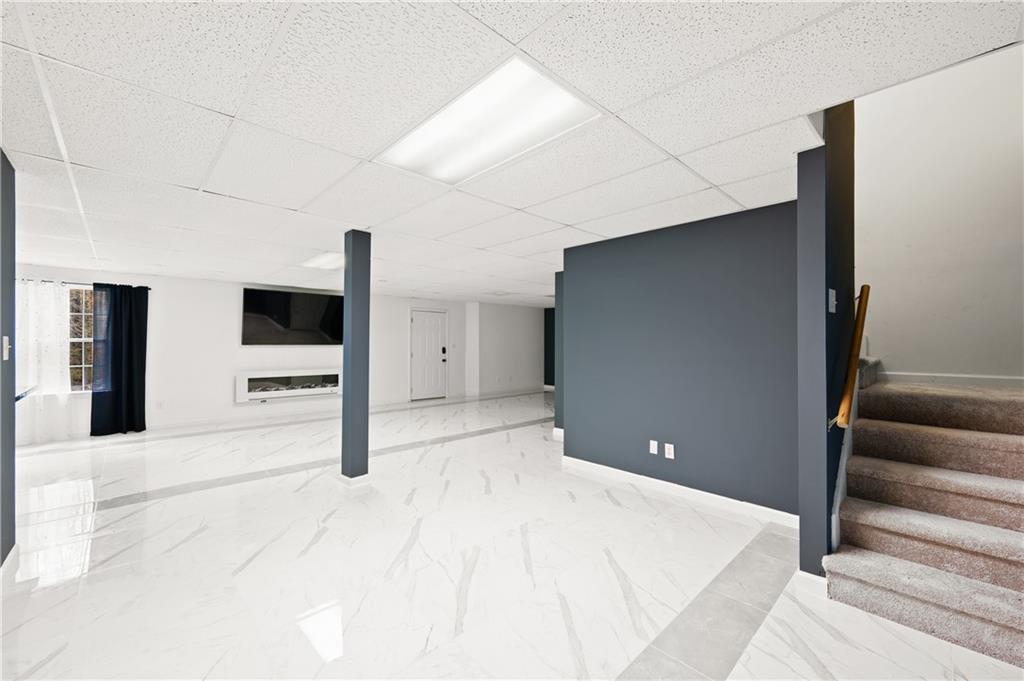 201 Nina Circle Locust Grove, GA 30248 - Photo 28 of 48 a bedroom with a bed and a television