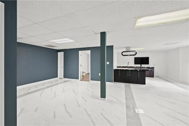 a kitchen with a cabinets and chairs