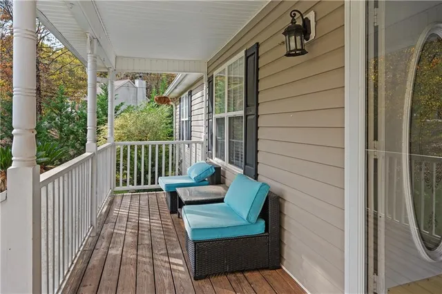 a view of a two chairs in the balcony