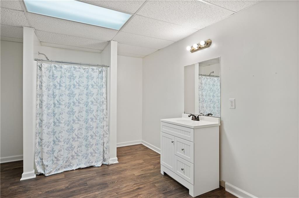 201 Nina Circle Locust Grove, GA 30248 - Photo 41 of 48 a hall with a sink and a mirror