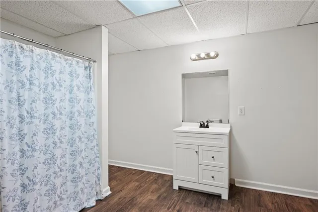 a view of balcony with wooden floor and seating space