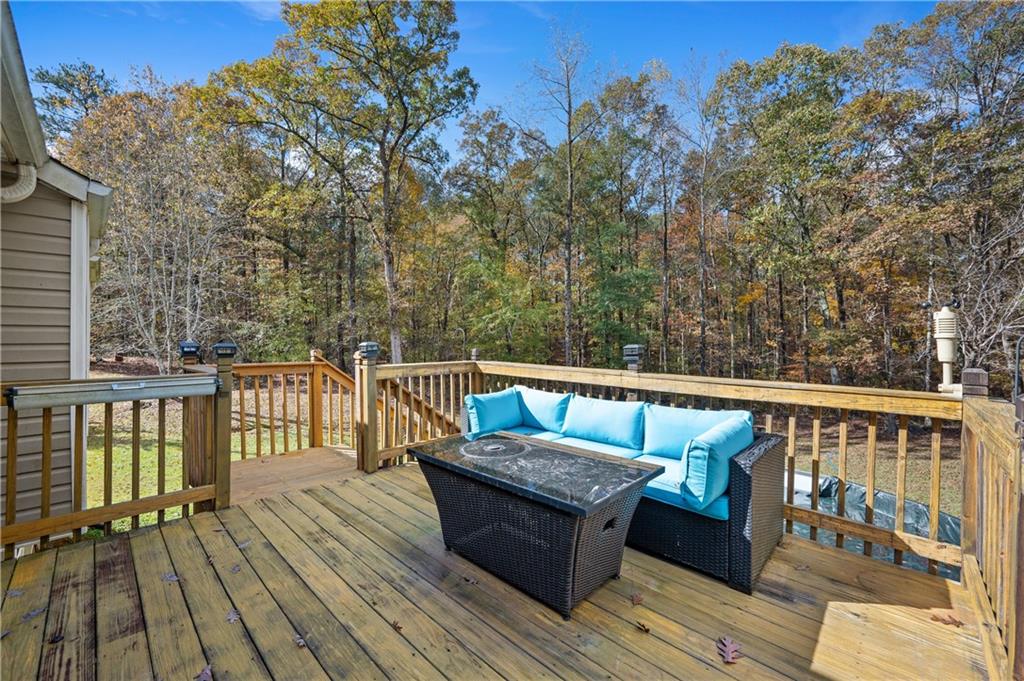 201 Nina Circle Locust Grove, GA 30248 - Photo 43 of 48 a view of balcony with wooden floor and seating space