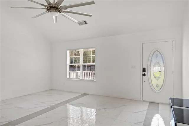 an empty room with windows