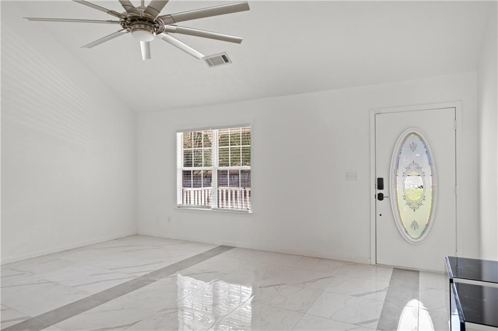 201 Nina Circle Locust Grove, GA 30248 - Photo 7 of 48 an empty room with windows