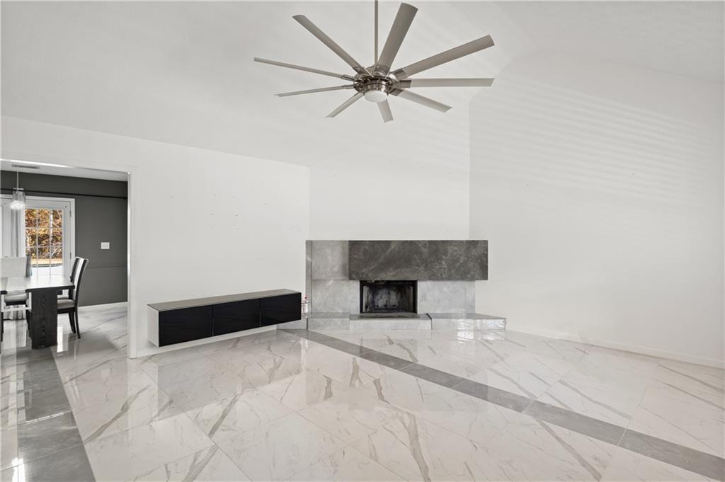 201 Nina Circle Locust Grove, GA 30248 - Photo 8 of 48 en empty room with ceiling fan and window