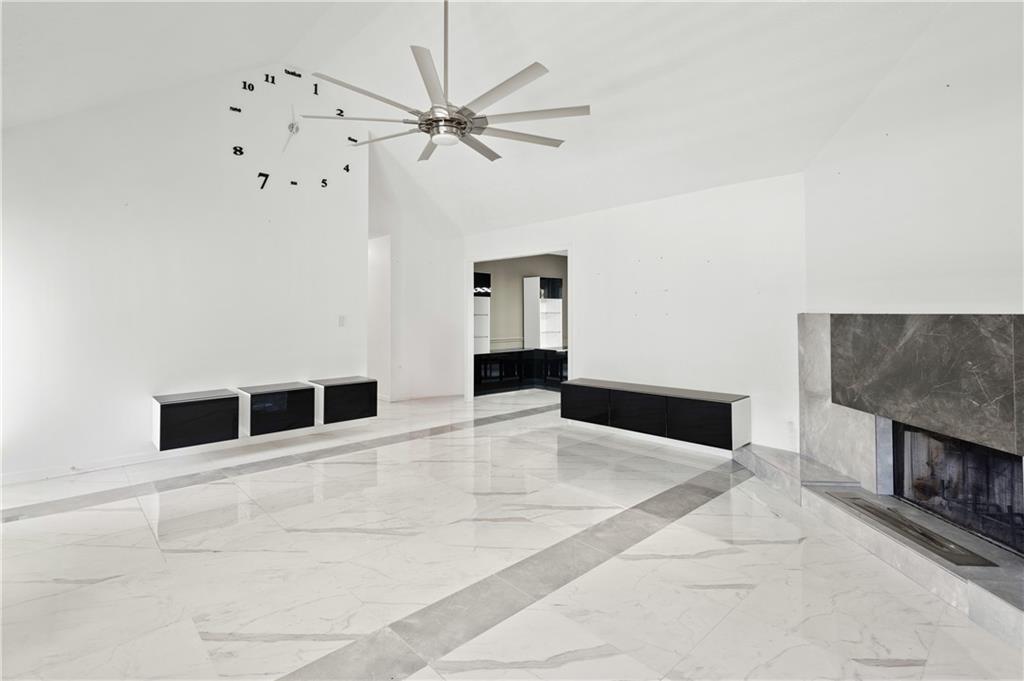 201 Nina Circle Locust Grove, GA 30248 - Photo 10 of 48 a view of an empty room with chandelier fan