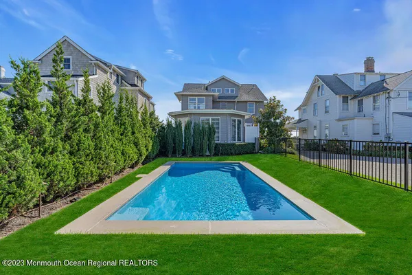 a view of swimming pool with a yard
