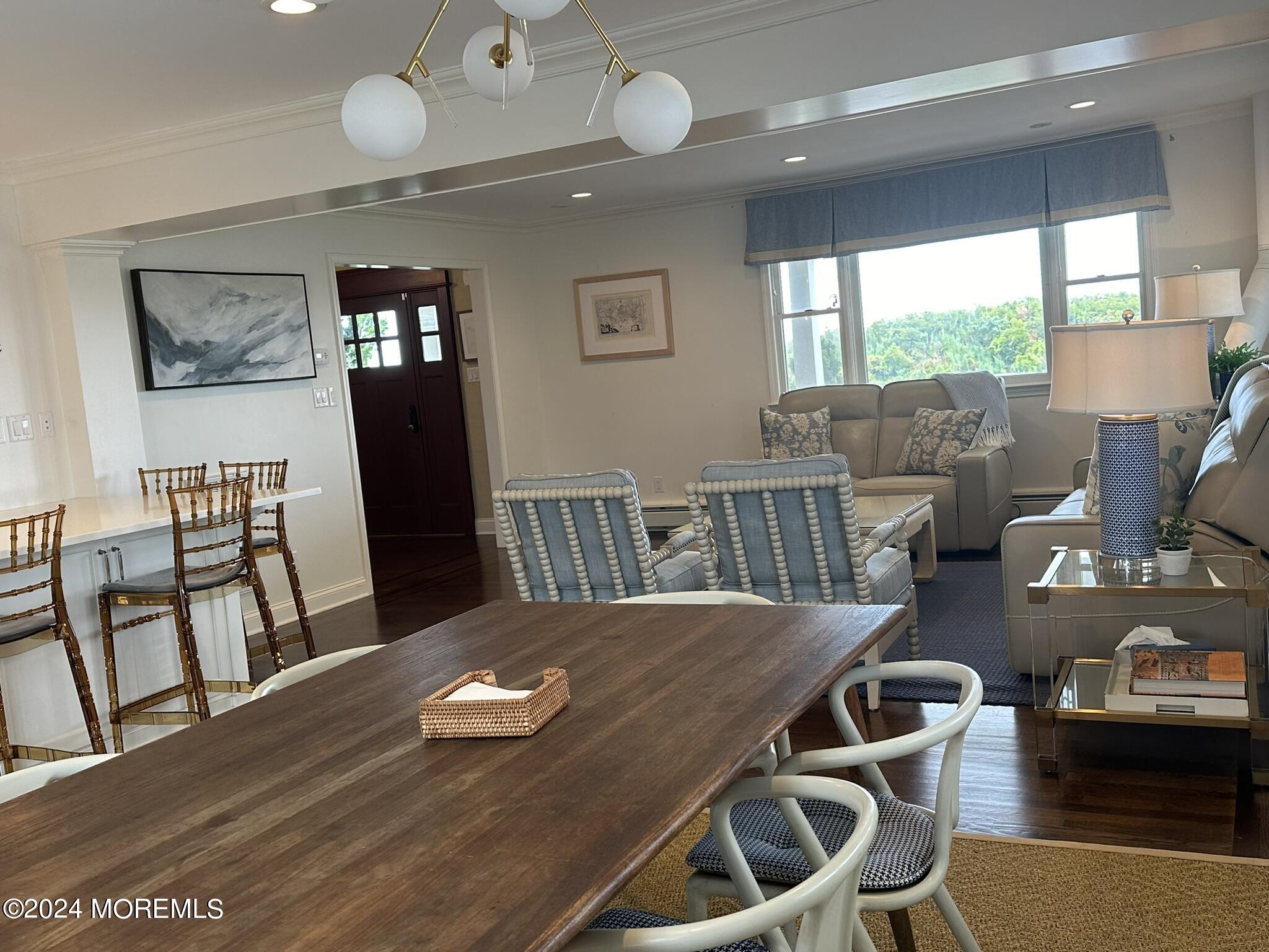 1609 Ocean Avenue Spring Lake, NJ 07762 - Photo 13 of 30 a view of a dining room with furniture window and wooden floor