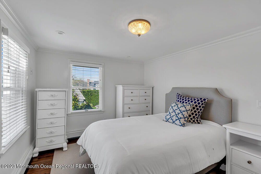 1609 Ocean Avenue Spring Lake, NJ 07762 - Photo 23 of 30 a bedroom with a bed and a window