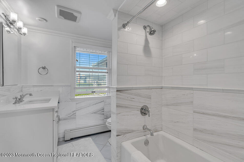 1609 Ocean Avenue Spring Lake, NJ 07762 - Photo 24 of 30 a bathroom with a sink a toilet and shower