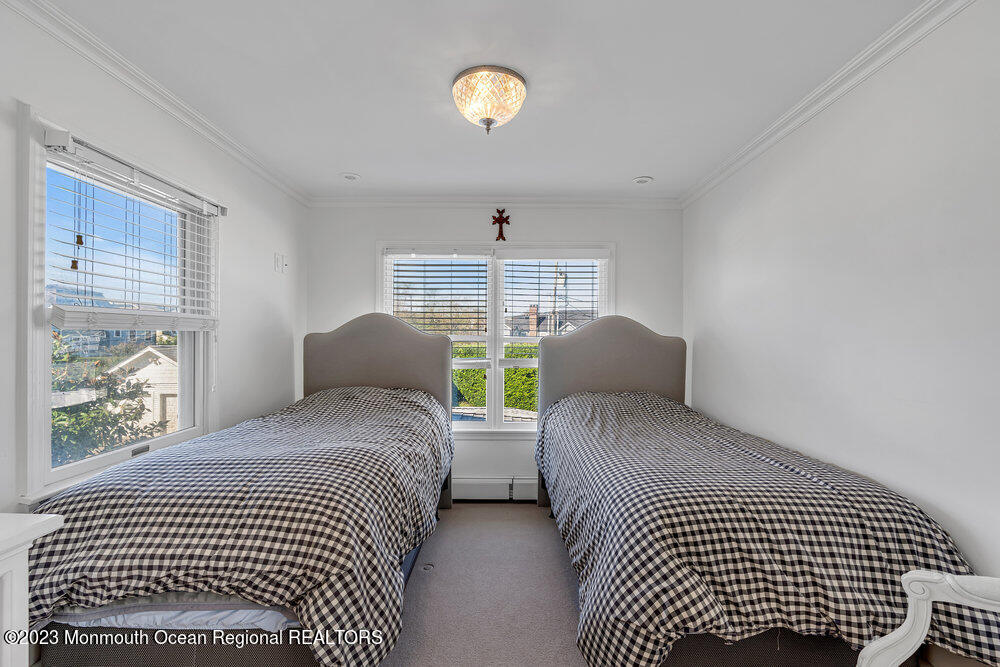 1609 Ocean Avenue Spring Lake, NJ 07762 - Photo 27 of 30 a bedroom with a bed and a window