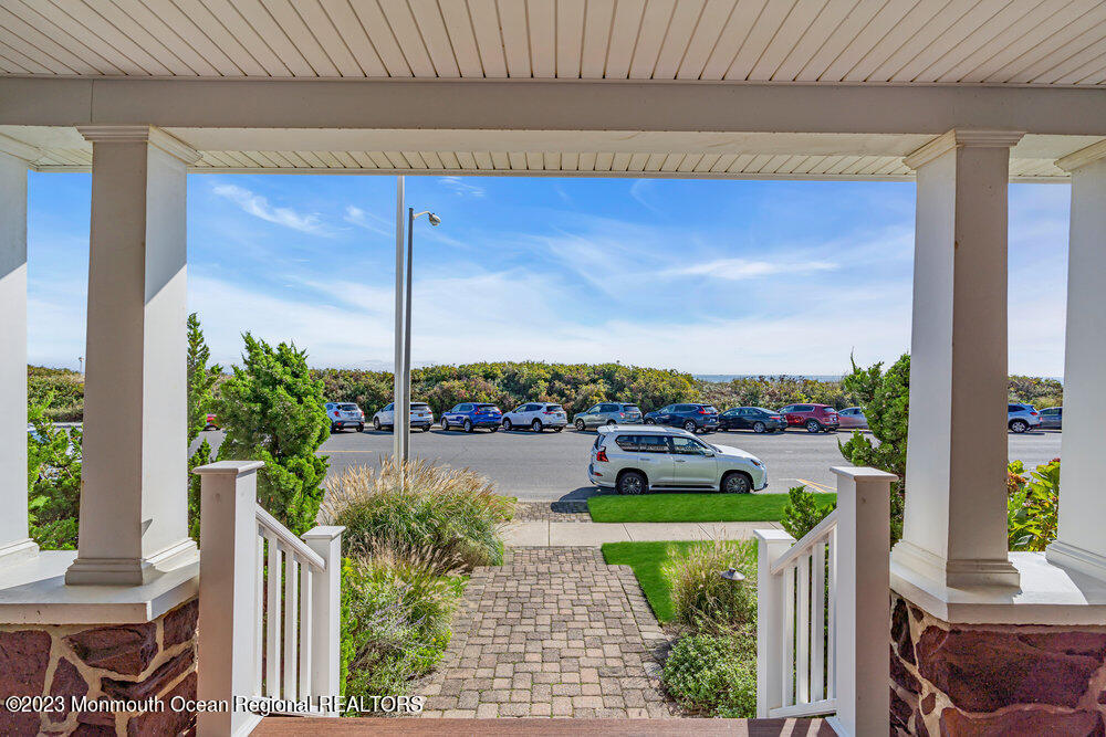 1609 Ocean Avenue Spring Lake, NJ 07762 - Photo 5 of 30 a front view of a house with a garden and plants