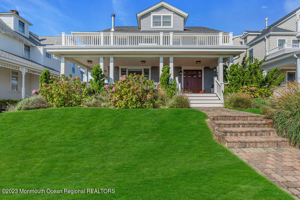 1609 Ocean Avenue Spring Lake, NJ 07762 - Photo 6 of 30 a front view of a house with a yard