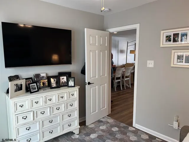 a kitchen with stainless steel appliances kitchen island granite countertop a refrigerator and cabinets
