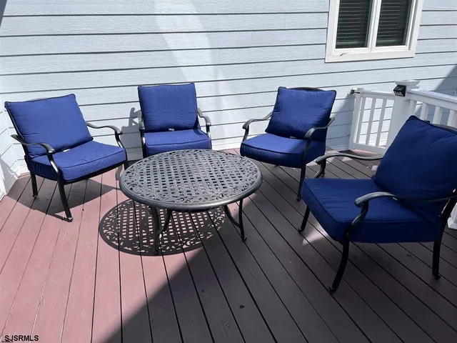 a view of a chairs in patio of the house