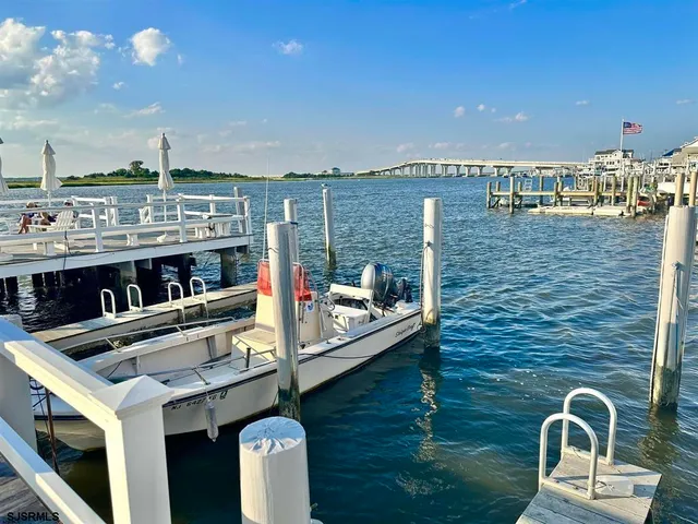 a view of a dinning tables and chairs in the balcony
