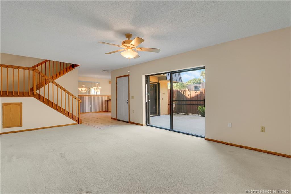5662 Southeast Windsong Lane, Unit 408 Stuart, FL 34997 - Photo 12 of 35 a view of an empty room with a window