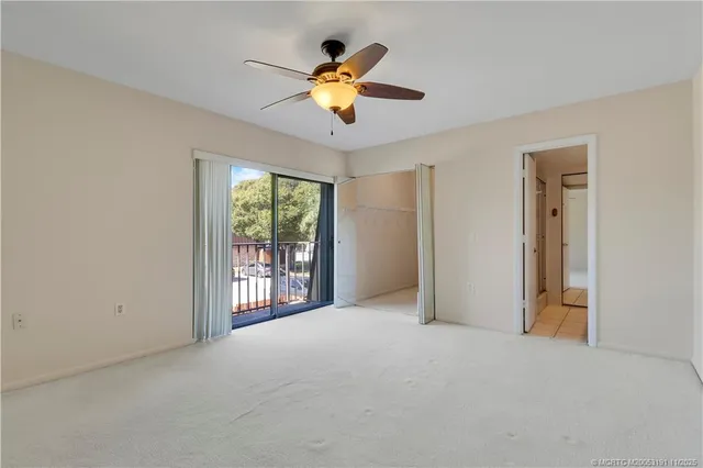 a view of empty room with windows