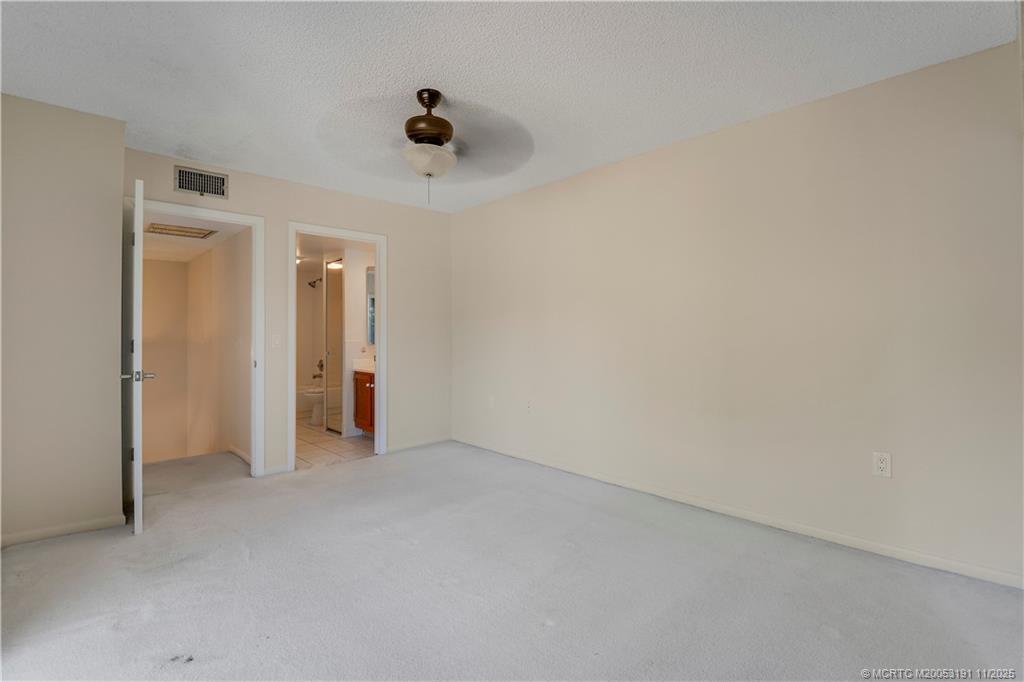 5662 Southeast Windsong Lane, Unit 408 Stuart, FL 34997 - Photo 29 of 35 a view of empty room