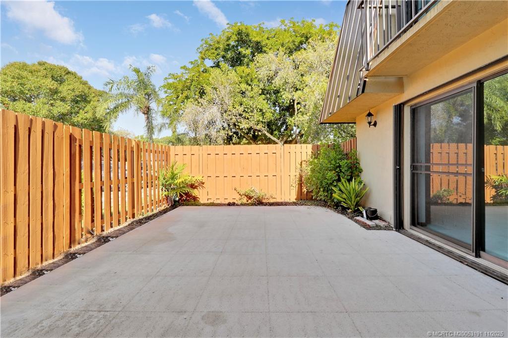 5662 Southeast Windsong Lane, Unit 408 Stuart, FL 34997 - Photo 34 of 35 a view of a pathway with a yard