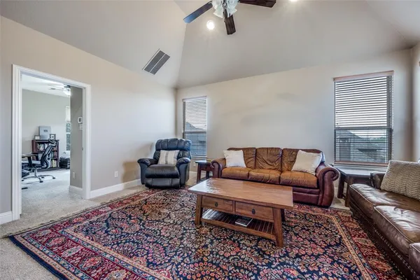a living room with furniture and a rug