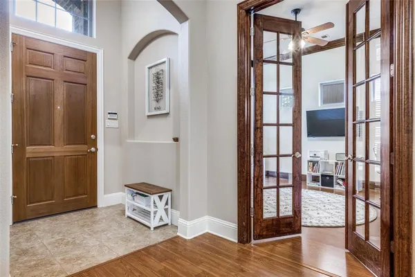 a view of an entryway with wooden floor