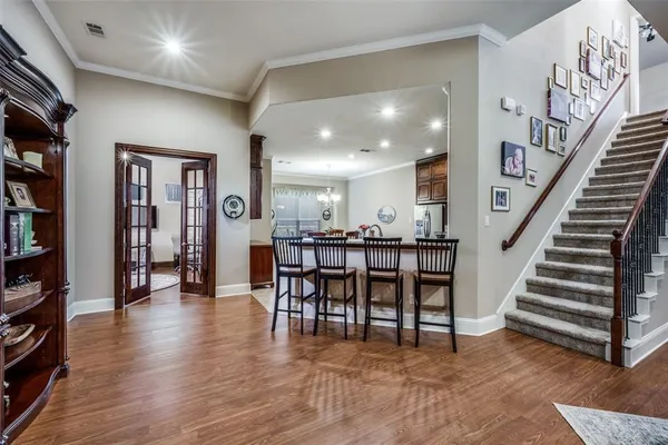 a view of a livingroom with furniture and stairs