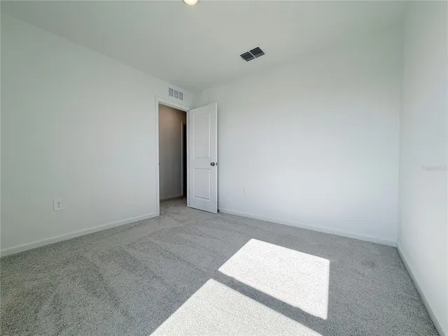 an empty room with an entryway