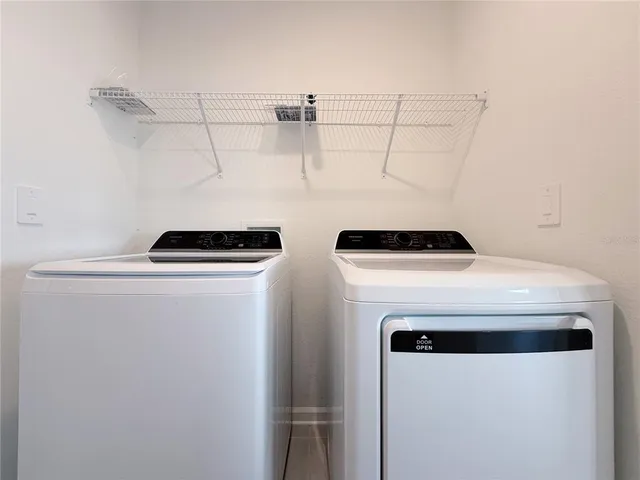 a utility room with dryer and washer