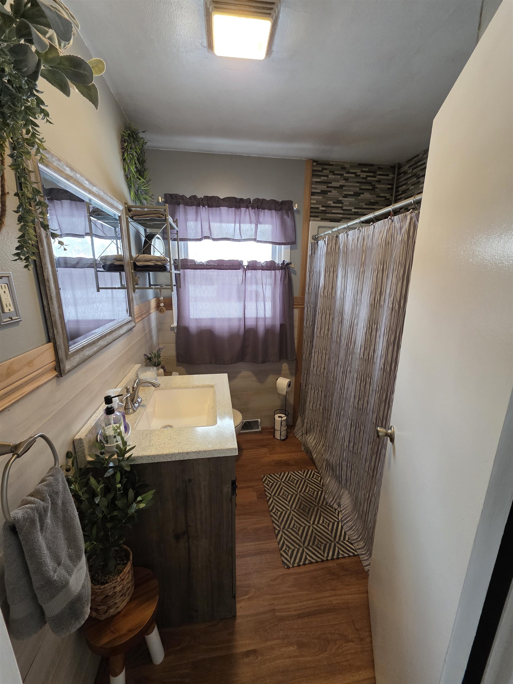 8617 Vicki Road Rockford, IL 61108 - Photo 11 of 22 a bathroom with a sink toilet and shower