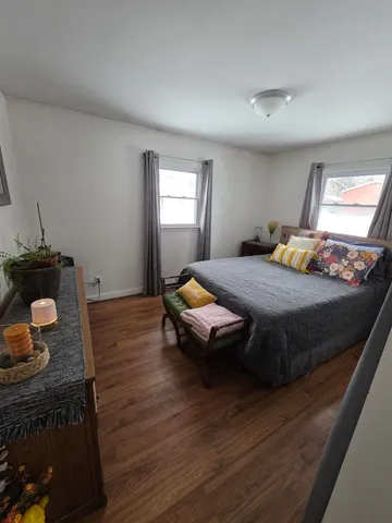 a bedroom with a bed and cabinets