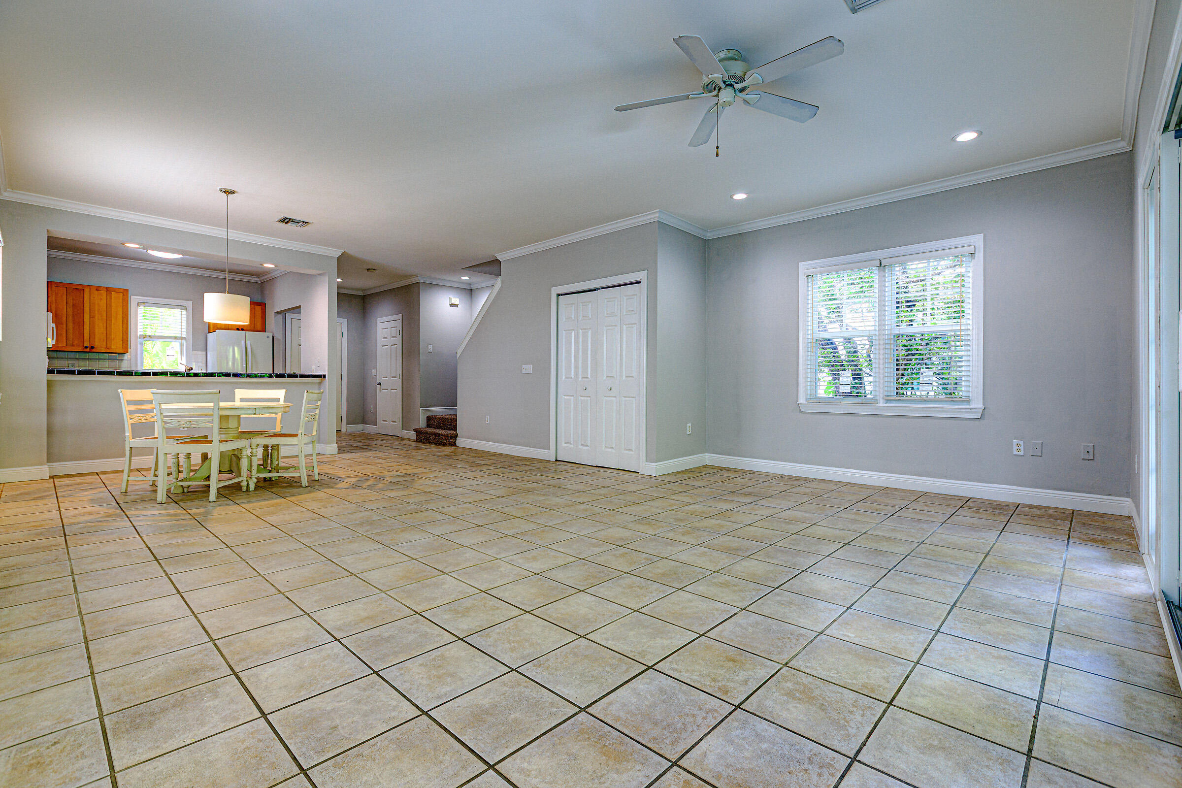 263 Golf Club Drive Key West, FL 33040 - Photo 10 of 30 a view of a livingroom with furniture a ceiling fan and window