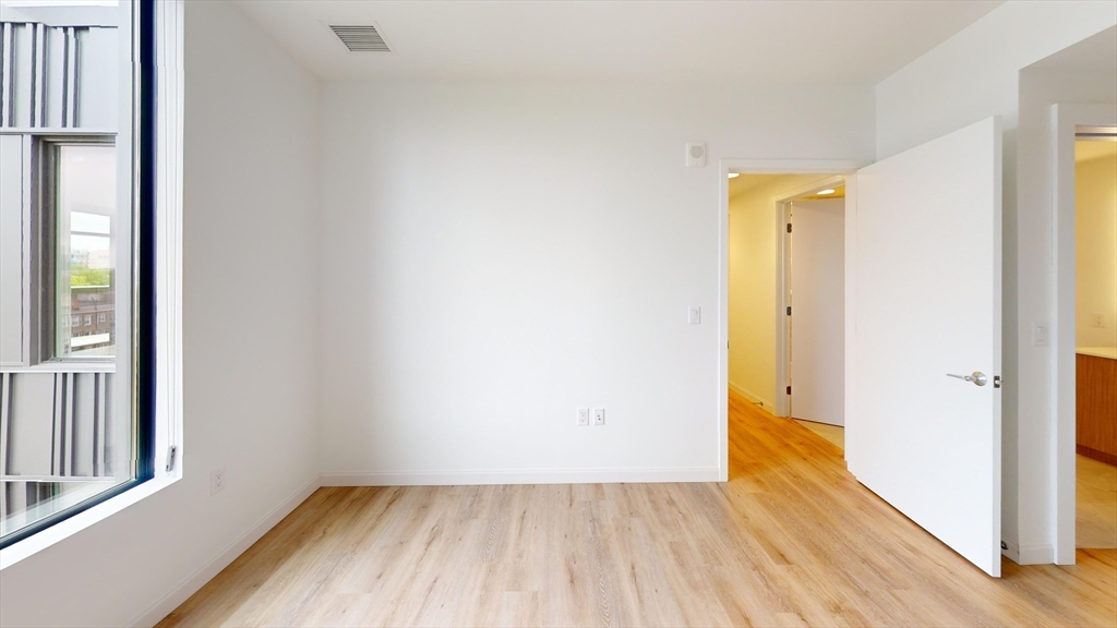 60 Kilmarnock Street, Unit 842 Boston, MA 02215 - Photo 5 of 13 a view of a hallway with wooden floor