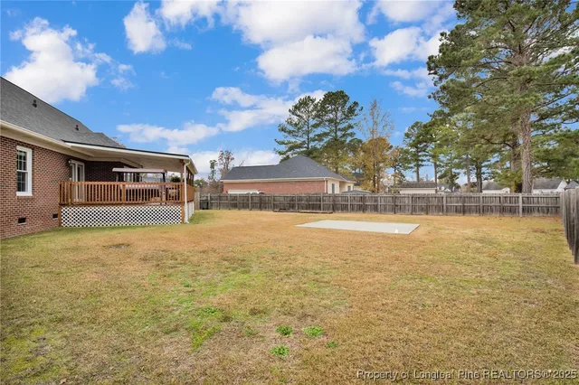 a swimming pool with outdoor seating and yard