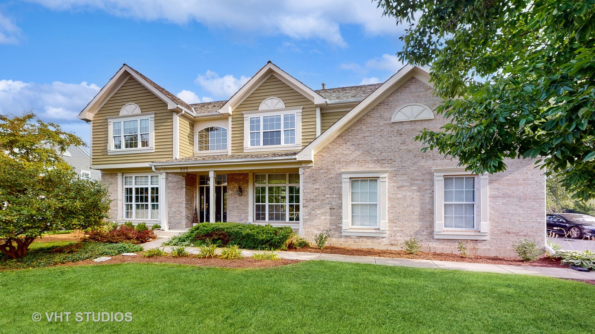 305 Saddle Lane Fox River Grove, IL 60021 - Photo 1 of 55 a front view of a house with a yard
