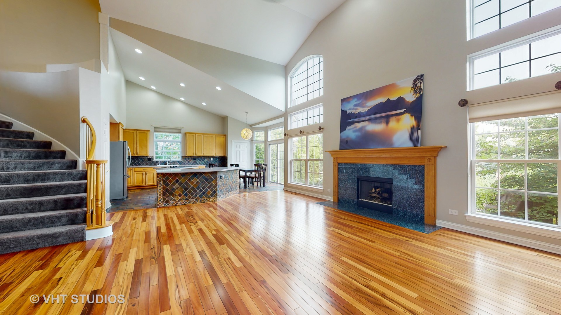 305 Saddle Lane Fox River Grove, IL 60021 - Photo 15 of 55 a view of a living room with wooden floor and a fireplace