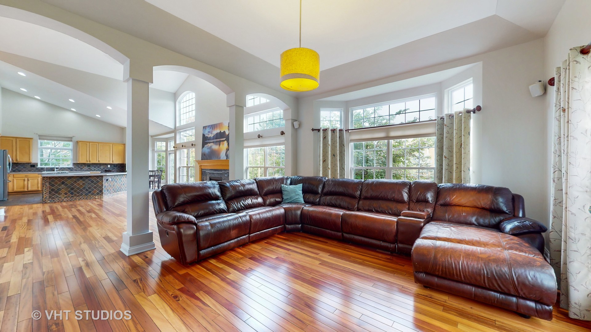 305 Saddle Lane Fox River Grove, IL 60021 - Photo 16 of 55 a living room with furniture cabinets and a chandelier